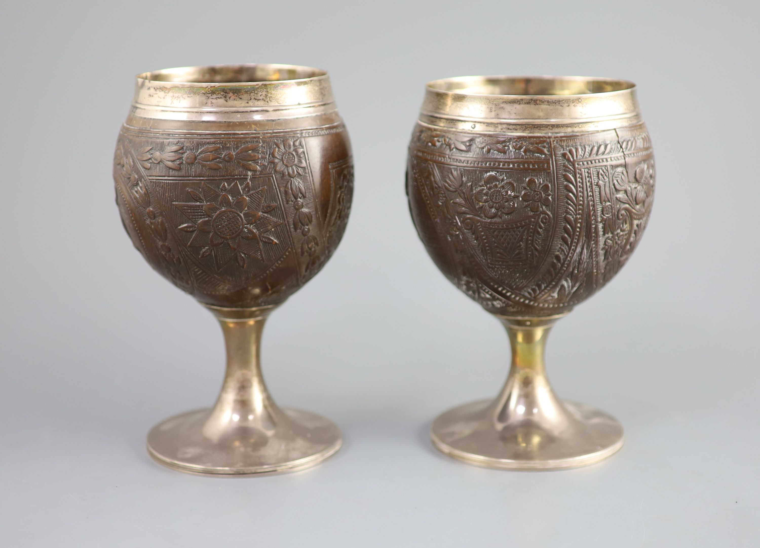 A pair of George III silver mounted coconut cups by Phipps & Robinson